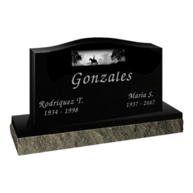 Black headstone with curve top and picture engraving with person on horse
